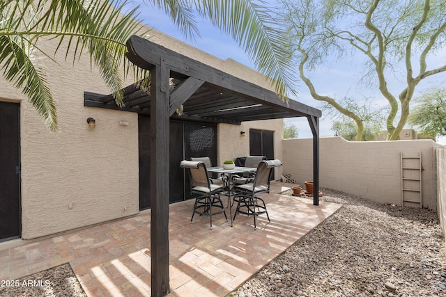 view of patio / terrace featuring outdoor dining area and fence