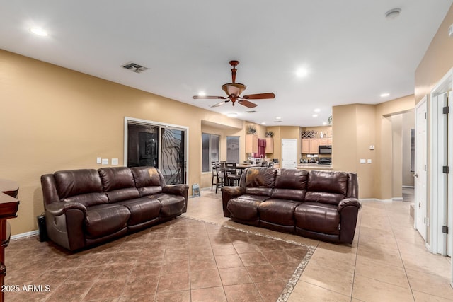 living room with recessed lighting, visible vents, a ceiling fan, light tile patterned flooring, and baseboards