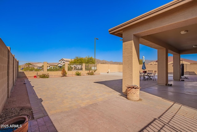 view of patio / terrace featuring outdoor dining area and a fenced backyard