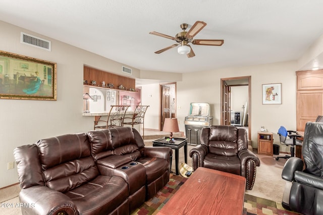 living room with dark colored carpet and ceiling fan