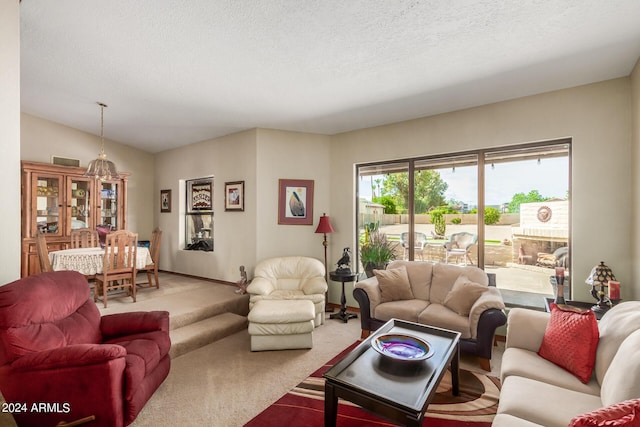 living room featuring carpet floors, a textured ceiling, and lofted ceiling