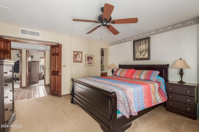 carpeted bedroom with ceiling fan