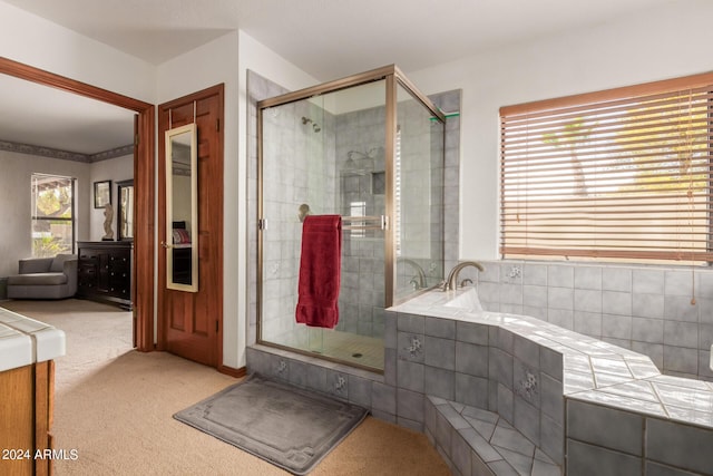 bathroom with plenty of natural light and plus walk in shower