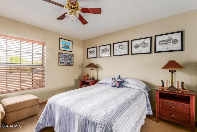 carpeted bedroom with ceiling fan