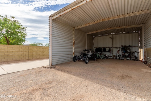 garage featuring a carport