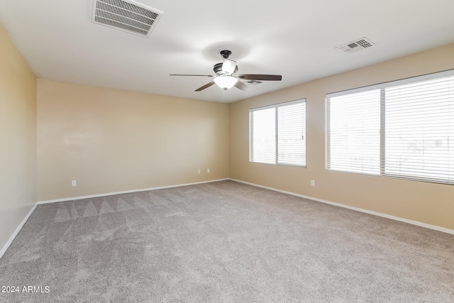 empty room with light carpet and ceiling fan