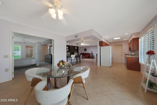 dining space featuring a ceiling fan, recessed lighting, visible vents, and light tile patterned floors