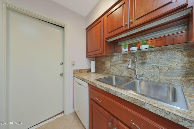 kitchen featuring a sink, light countertops, dishwasher, tasteful backsplash, and brown cabinetry