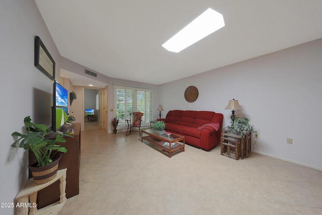 living room with visible vents and baseboards