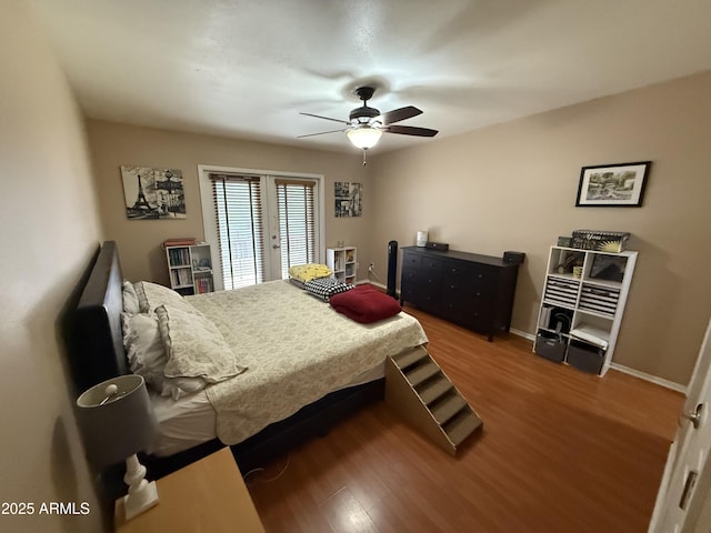 4615 N 22nd St Unit 113, Phoenix, AZ 85016 - bedroom featuring ceiling fan, french doors, baseboards, and wood finished floors
