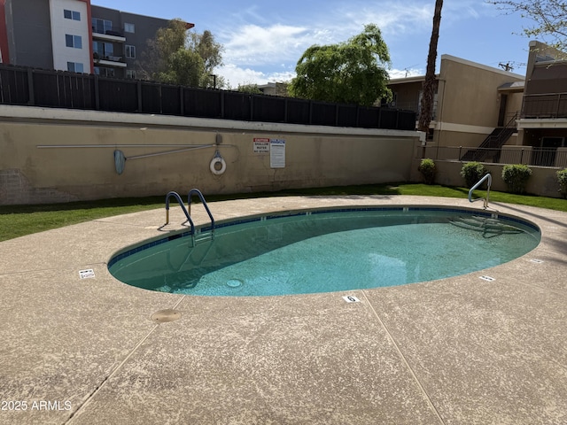 4615 N 22nd St Unit 113, Phoenix, AZ 85016 - pool featuring a patio area and fence