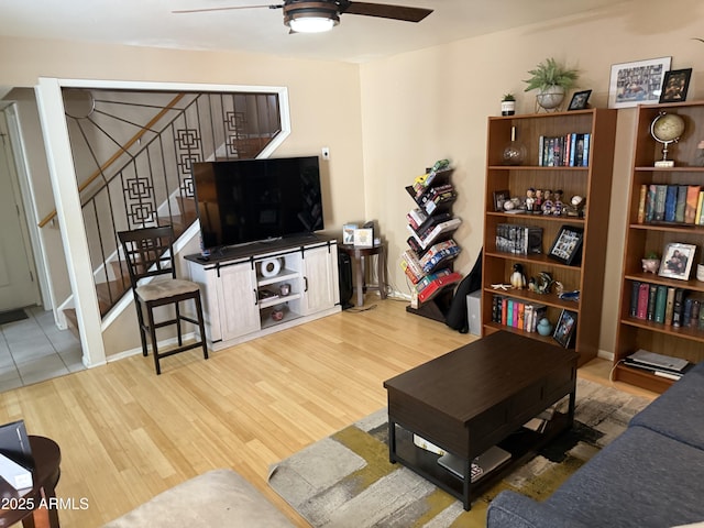 4615 N 22nd St Unit 113, Phoenix, AZ 85016 - living area with wood finished floors, a ceiling fan, and stairway