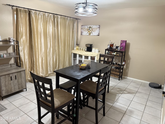 4615 N 22nd St Unit 113, Phoenix, AZ 85016 - dining space with light tile patterned flooring and baseboards