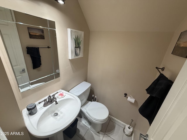 4615 N 22nd St Unit 113, Phoenix, AZ 85016 - bathroom with tile patterned floors, a sink, toilet, and lofted ceiling