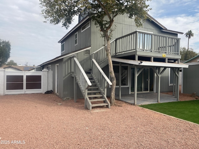 rear view of house featuring a patio