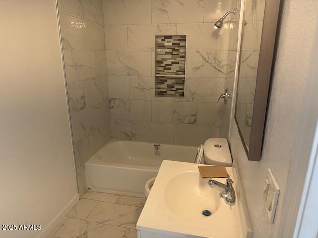 full bathroom with vanity, tiled shower / bath, and toilet