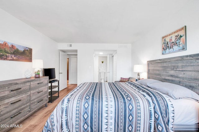 bedroom with light hardwood / wood-style flooring