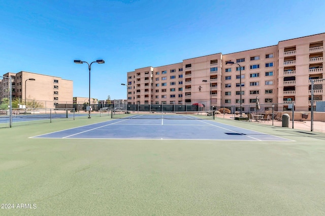 view of sport court with basketball hoop