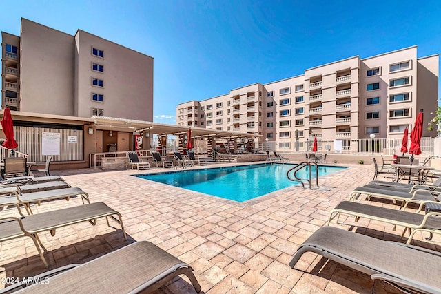 view of swimming pool with a patio area