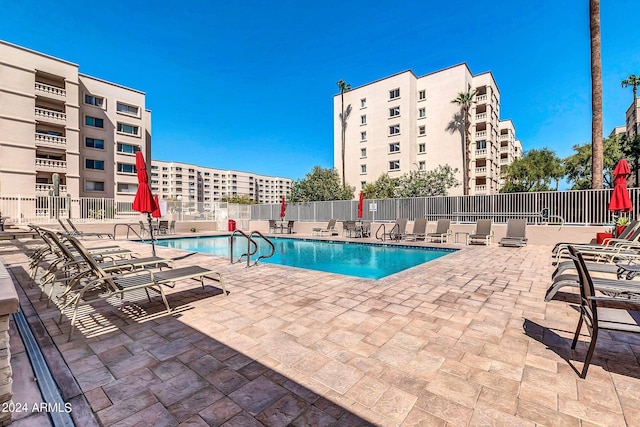 view of pool featuring a patio