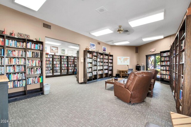 living area featuring carpet floors