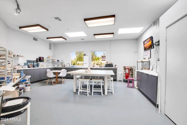 dining space featuring concrete flooring