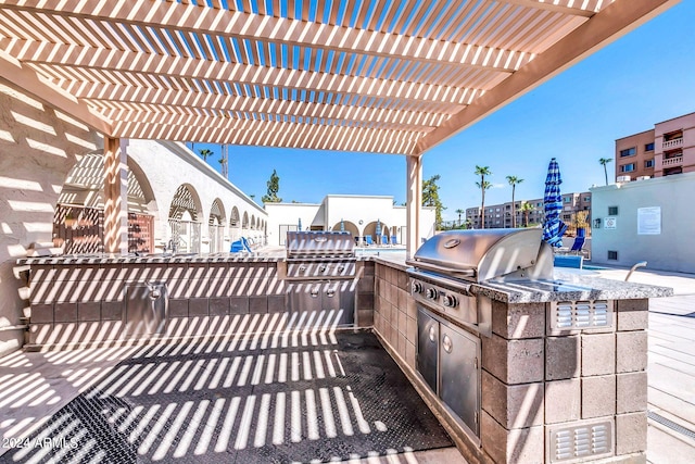 view of patio / terrace featuring a pergola, area for grilling, and grilling area