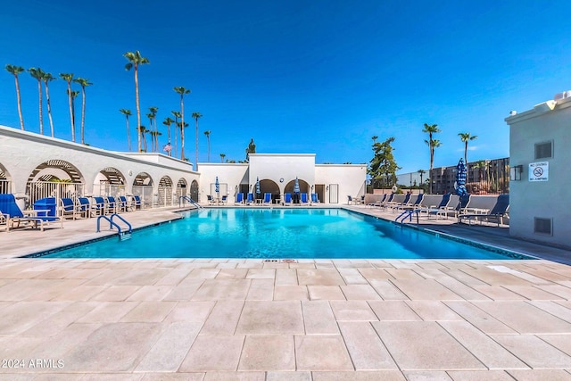 view of swimming pool featuring a patio