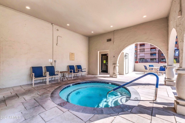 view of pool featuring an indoor in ground hot tub and a patio