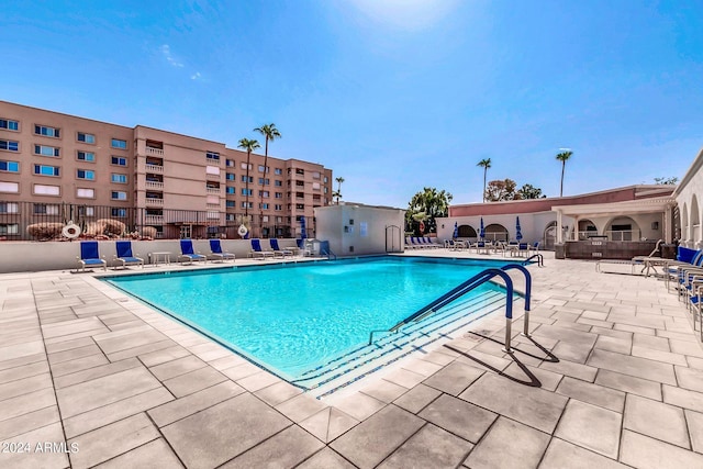 view of swimming pool with a patio area