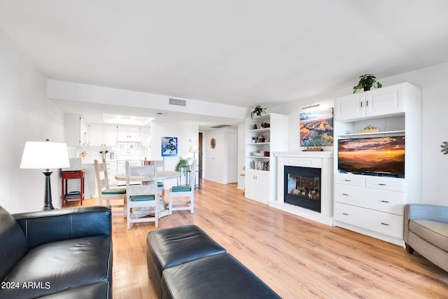 living room with light hardwood / wood-style floors