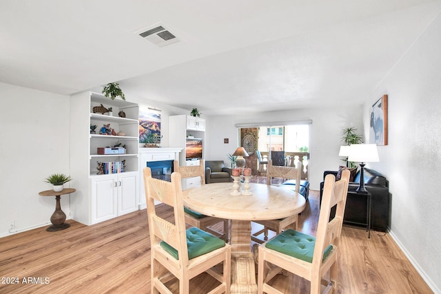 dining space featuring light hardwood / wood-style floors