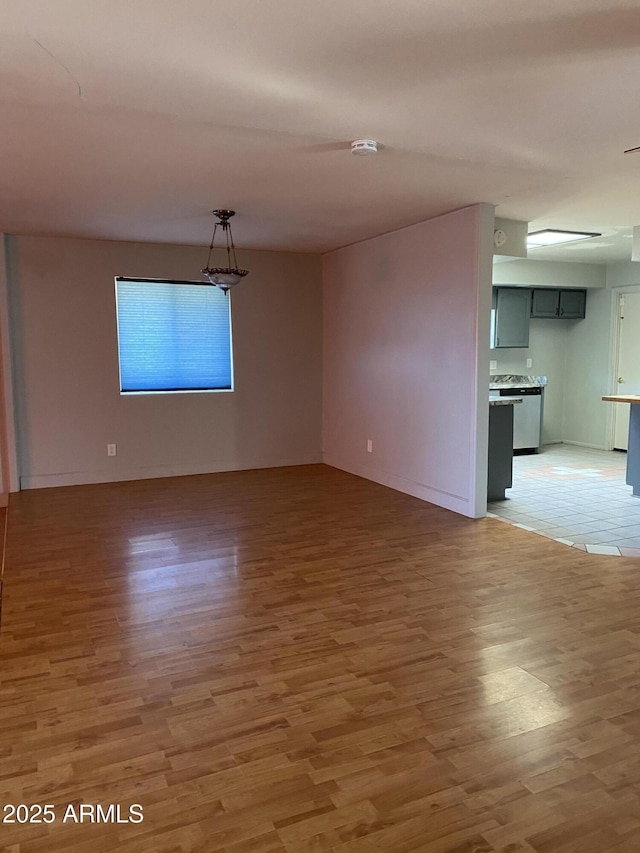 unfurnished room featuring hardwood / wood-style flooring