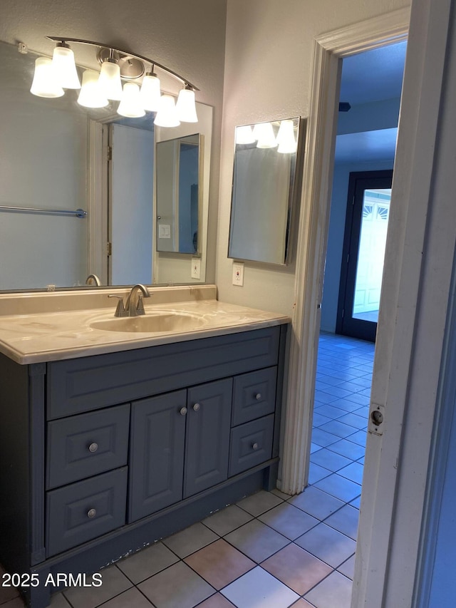 bathroom featuring tile patterned floors and vanity