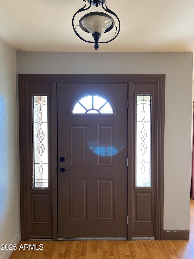 foyer with light hardwood / wood-style floors