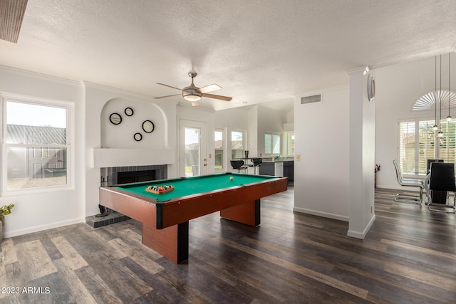 rec room with ceiling fan, pool table, dark wood-type flooring, and a brick fireplace