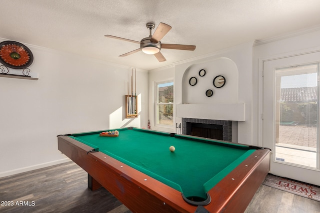 playroom with plenty of natural light, dark hardwood / wood-style floors, and a fireplace