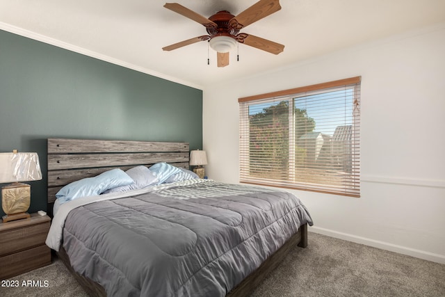 bedroom with ceiling fan, dark carpet, and ornamental molding