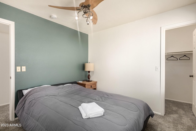 bedroom featuring ceiling fan and dark colored carpet