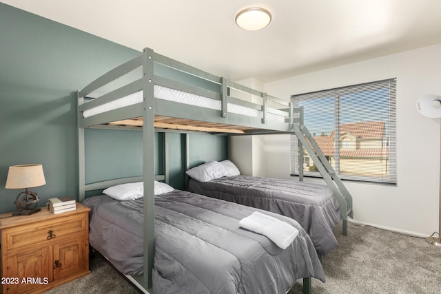 bedroom with dark carpet