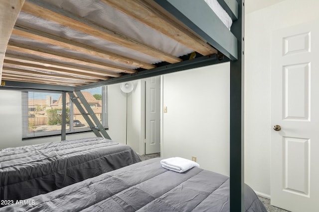 bedroom featuring dark colored carpet