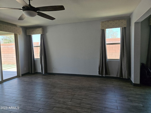 9302 W Georgia Ave, Glendale, AZ 85305 - spare room featuring plenty of natural light, ceiling fan, and dark wood-type flooring