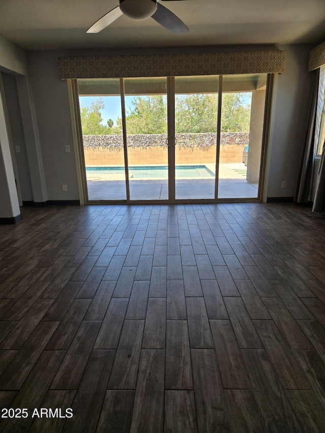 9302 W Georgia Ave, Glendale, AZ 85305 - empty room with ceiling fan, dark wood-style floors, and baseboards