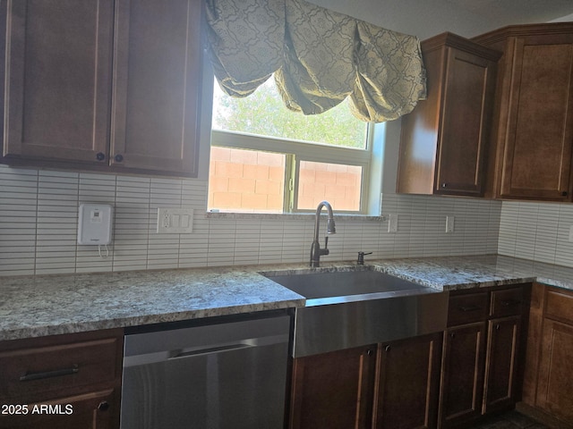 9302 W Georgia Ave, Glendale, AZ 85305 - kitchen featuring dishwasher, backsplash, a sink, and light stone countertops