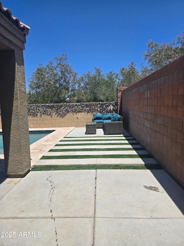 9302 W Georgia Ave, Glendale, AZ 85305 - fenced backyard with a patio and an outdoor hangout area