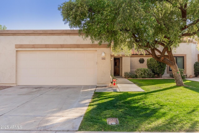 view of front of house featuring a garage and a front lawn