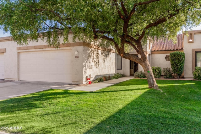 mediterranean / spanish-style home with a garage and a front yard