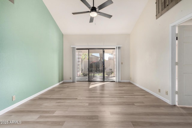 unfurnished room with ceiling fan, high vaulted ceiling, and light hardwood / wood-style flooring