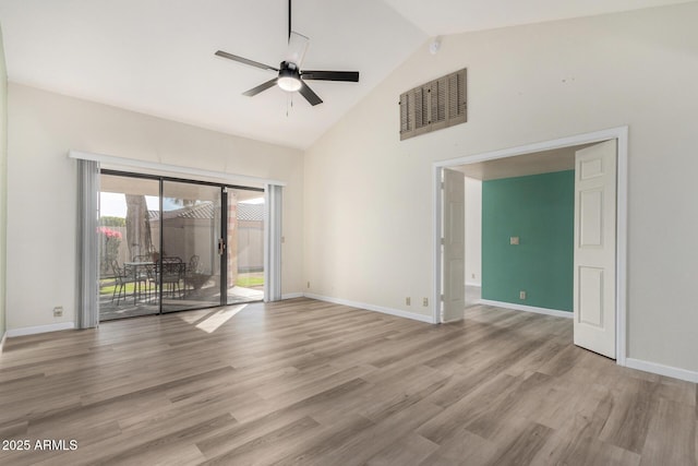 unfurnished room with ceiling fan, high vaulted ceiling, and light hardwood / wood-style flooring