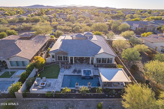 birds eye view of property with a mountain view